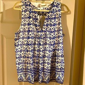 Blue and white Ikat print crepe lined sleeveless v neck blouse